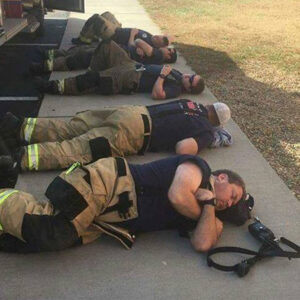 Man snaps heartbreaking photo of firefighters taking a rest after 24 hours of working nonstop